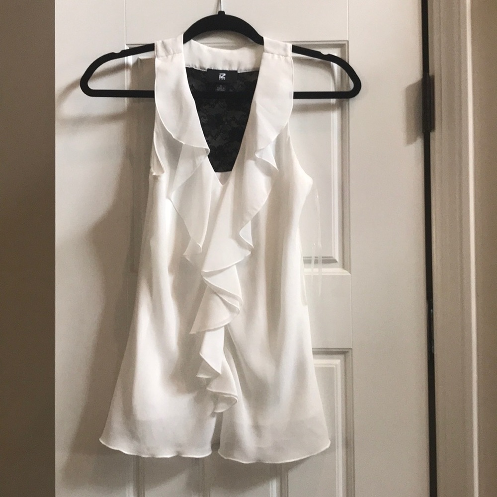 White IZ Byer silky blouse with lace back insert.